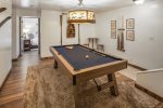 Grab a pool cue in the downstairs recreation room and play a game of 8 ball